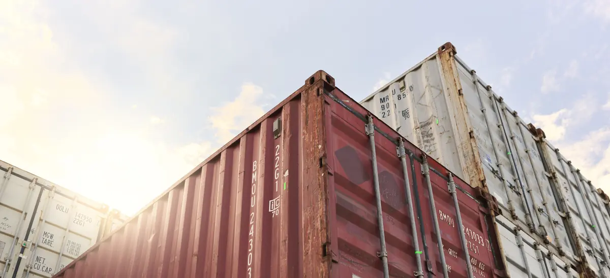 Shipping containers stacked high — all-water service between Phnom Penh and Vietnam